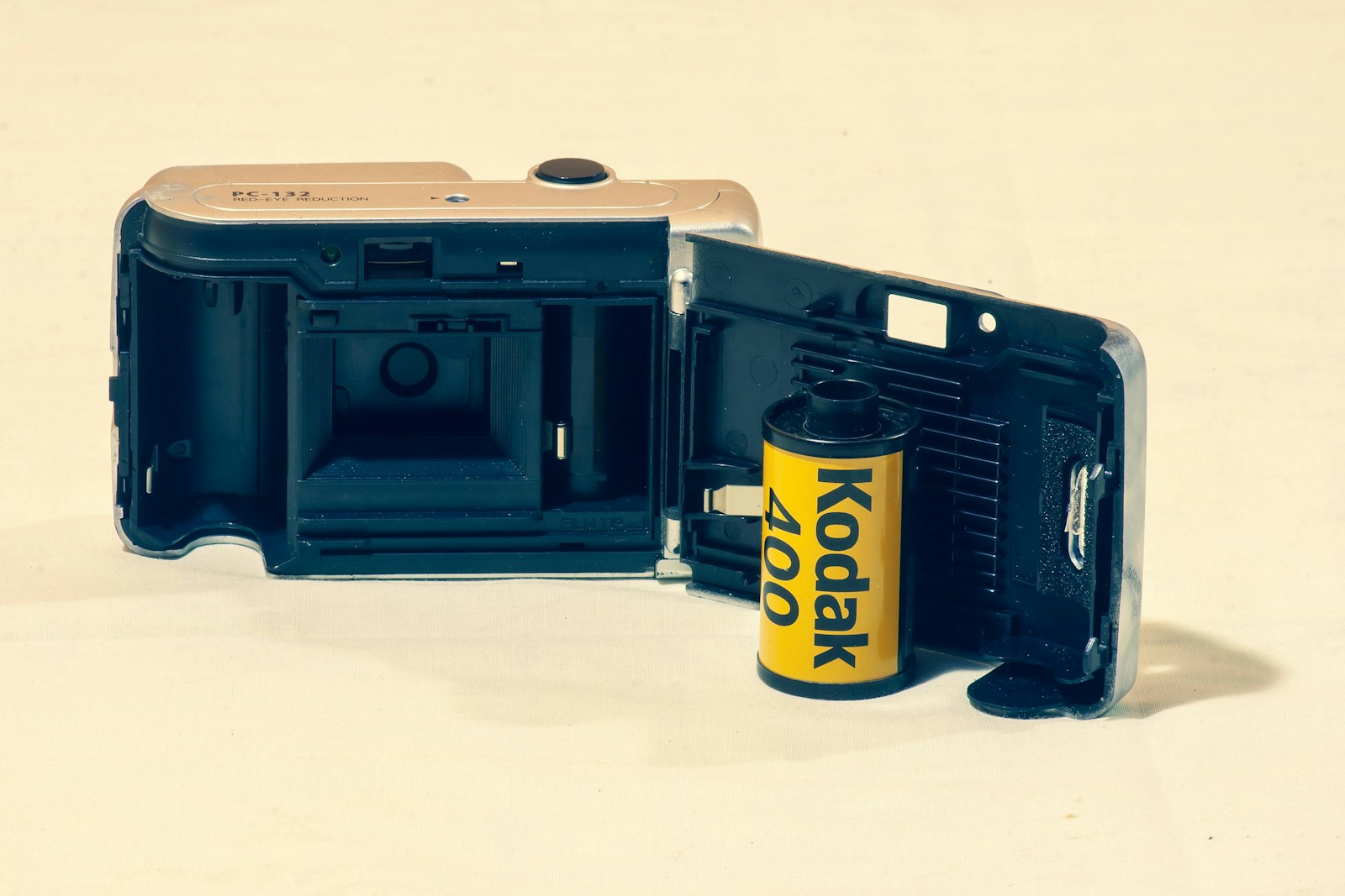 Camera with a kodak film roll inside.