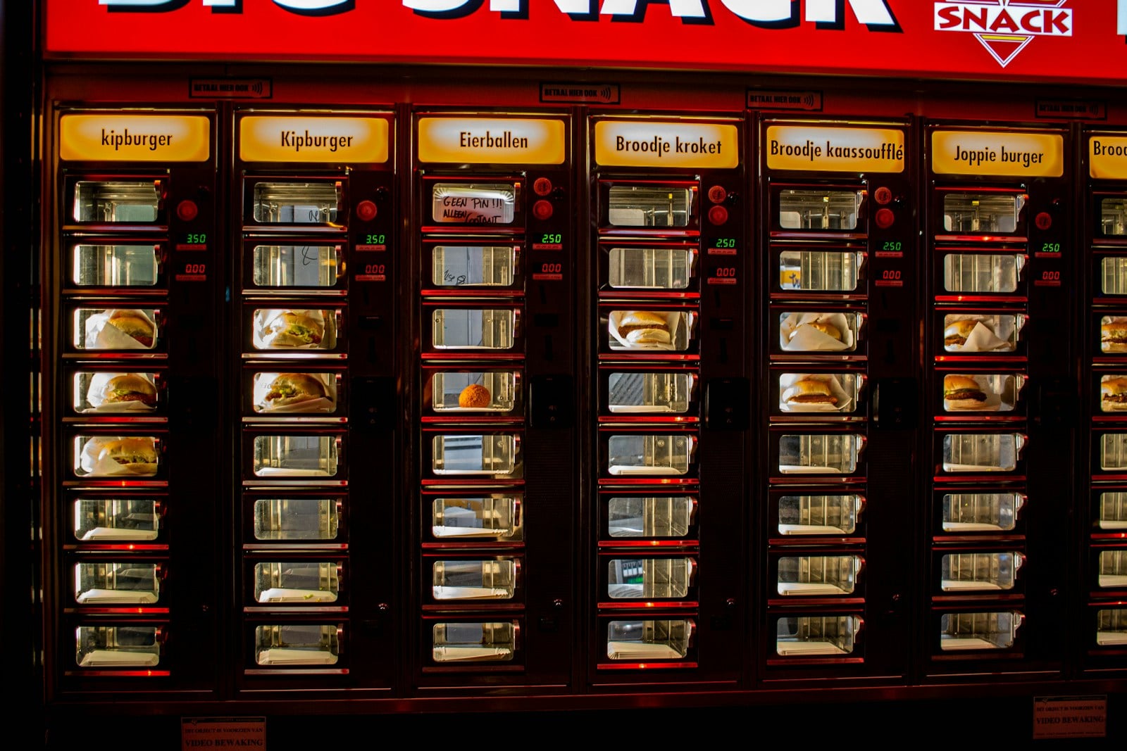 a big snack vending machine in front of a store